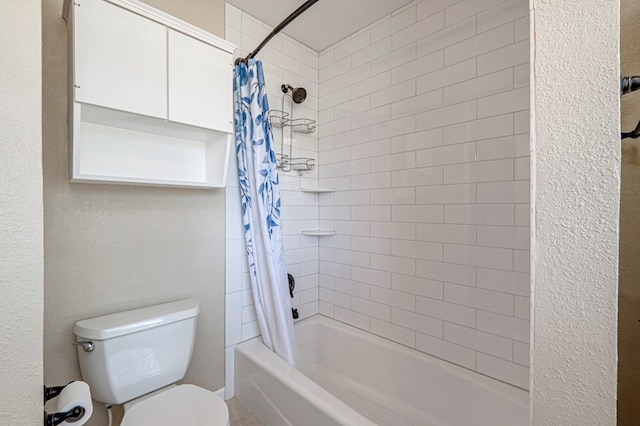 full bathroom with shower / bath combo with shower curtain and toilet