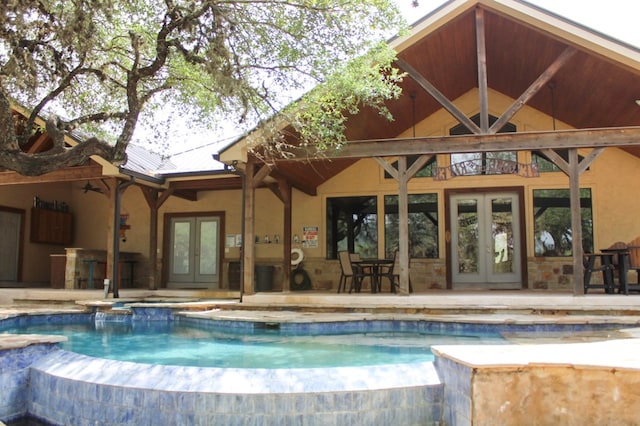 view of pool featuring a patio area and french doors