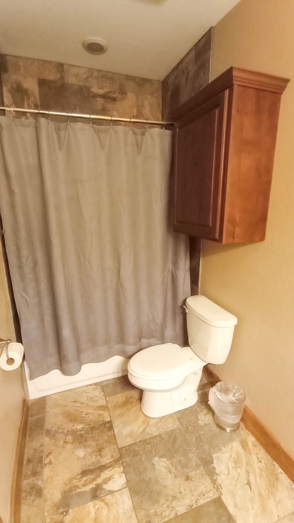 bathroom featuring toilet