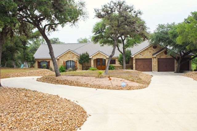 ranch-style home featuring a garage