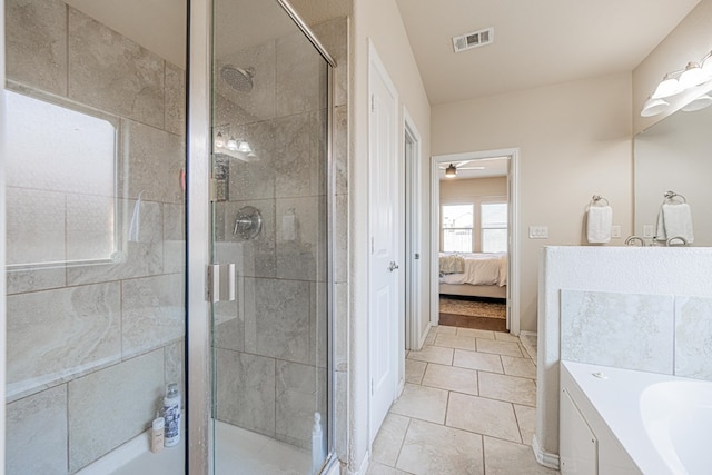 ensuite bathroom featuring a stall shower, visible vents, a garden tub, and connected bathroom