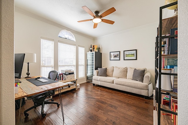 office with dark wood-style floors, a ceiling fan, and crown molding