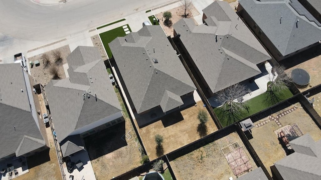 birds eye view of property with a residential view