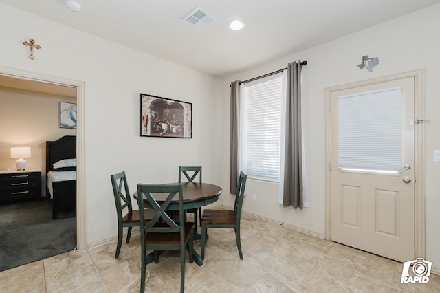 dining area with visible vents and baseboards