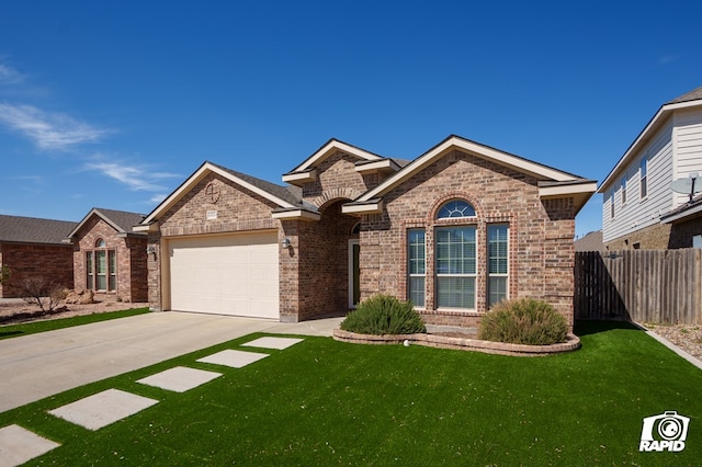 single story home with a garage, concrete driveway, brick siding, and fence