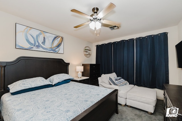 carpeted bedroom with visible vents and a ceiling fan