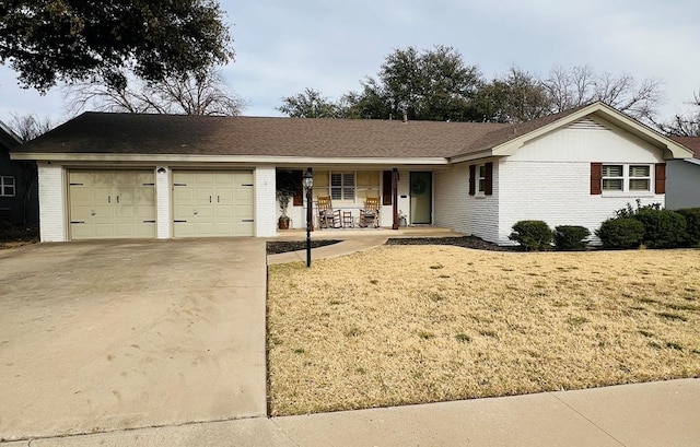 ranch-style home with a garage, a front yard, and a porch