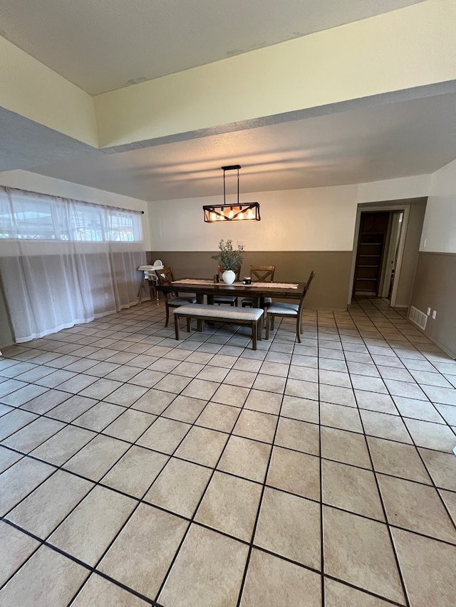 dining space with light tile patterned flooring