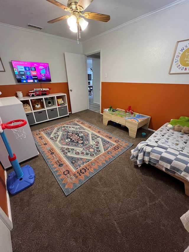 bedroom featuring ornamental molding, carpet, and ceiling fan