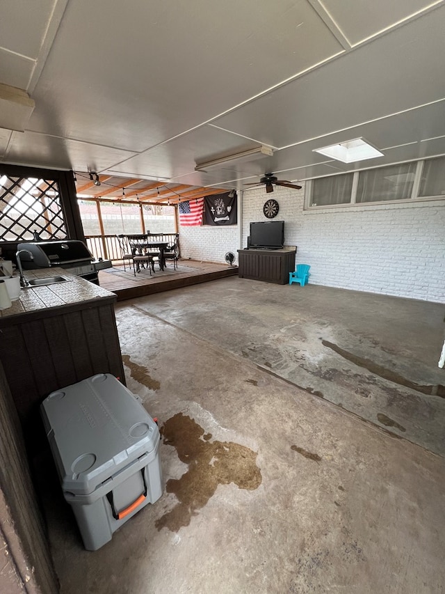 interior space featuring concrete floors and brick wall