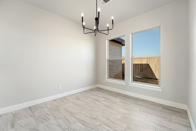 unfurnished dining area featuring a notable chandelier