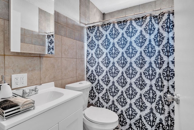 1105 Lamar Ave, Big Spring, TX 79720 - bathroom featuring toilet, tile walls, vanity, and a shower with shower curtain