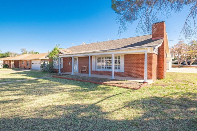 ranch-style home with covered porch and a front lawn