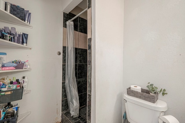 bathroom with walk in shower and toilet