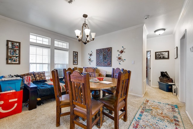 carpeted dining room with crown molding and a chandelier