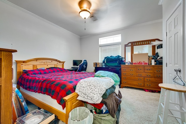 bedroom with ceiling fan, ornamental molding, and carpet