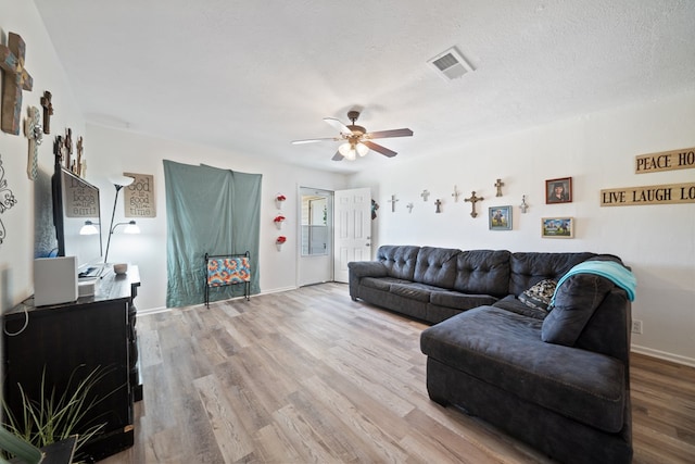 1213 Ridgeroad Dr, Big Spring, TX 79720 - living room with ceiling fan and wood finished floors