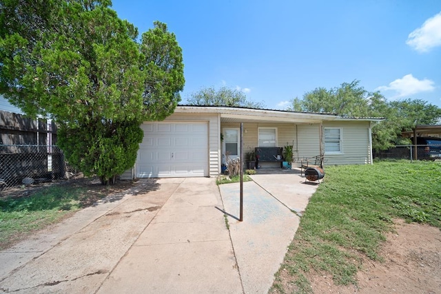 1213 Ridgeroad Dr, Big Spring, TX 79720 - view of front of house featuring concrete driveway and an attached garage