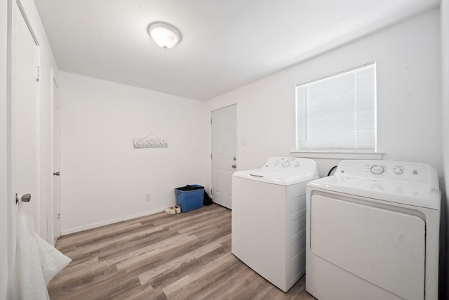 1213 Ridgeroad Dr, Big Spring, TX 79720 - washroom featuring washing machine and clothes dryer and light wood-type flooring