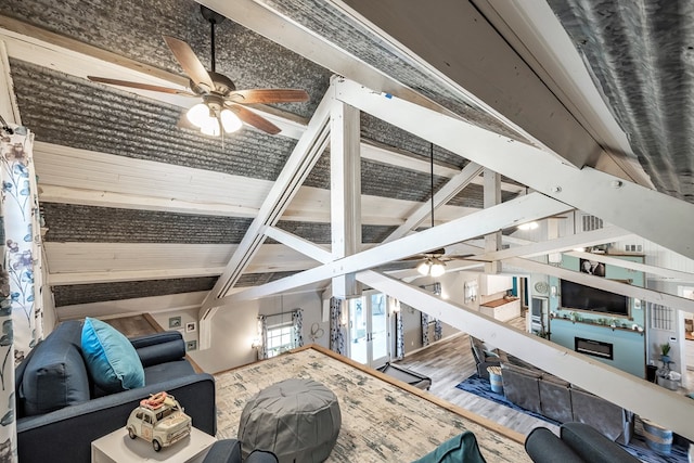 living room with ceiling fan, beam ceiling, wood-type flooring, and high vaulted ceiling