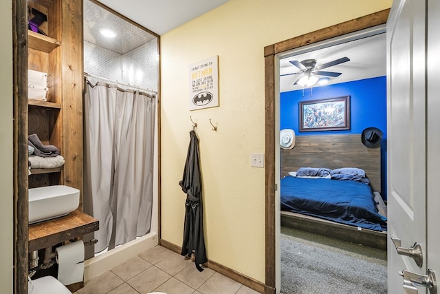 bathroom with ceiling fan, tile patterned flooring, and a shower with shower curtain