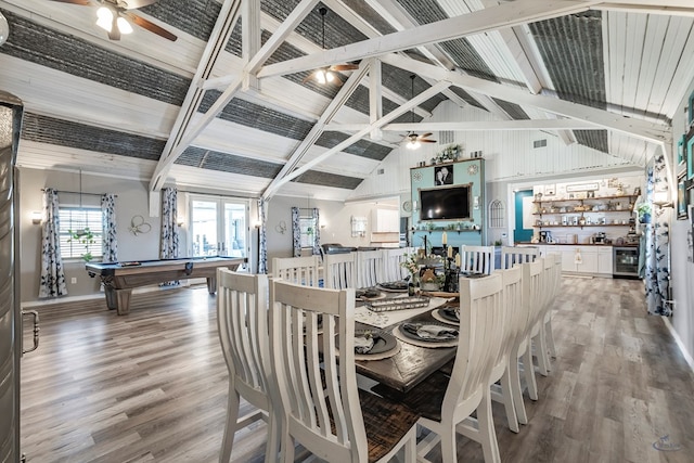 dining area with hardwood / wood-style floors, pool table, bar, beamed ceiling, and beverage cooler
