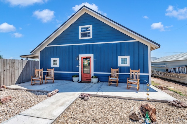 back of house with a patio