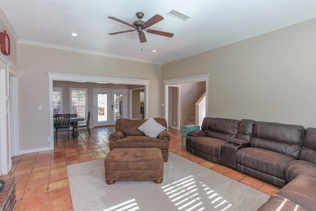 tiled living room with french doors, ceiling fan, and crown molding