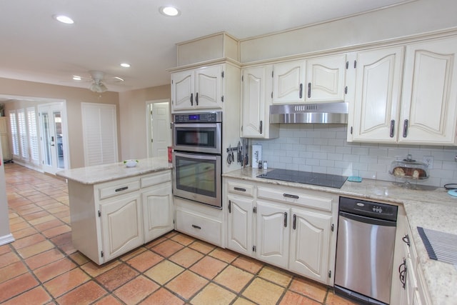 kitchen with black electric cooktop, stainless steel double oven, decorative backsplash, and white cabinets