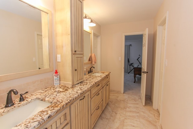 bathroom with vanity and backsplash