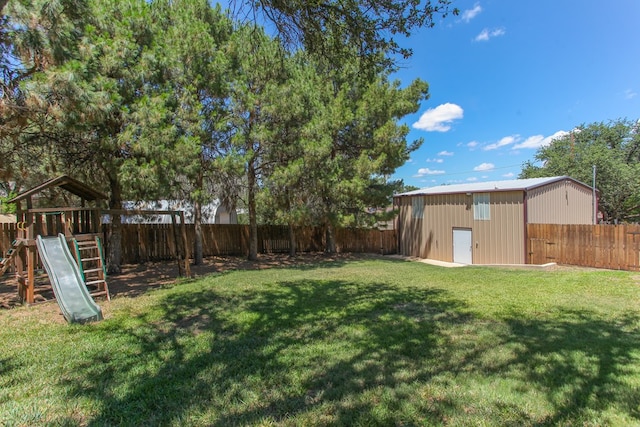 view of yard featuring an outdoor structure and a playground