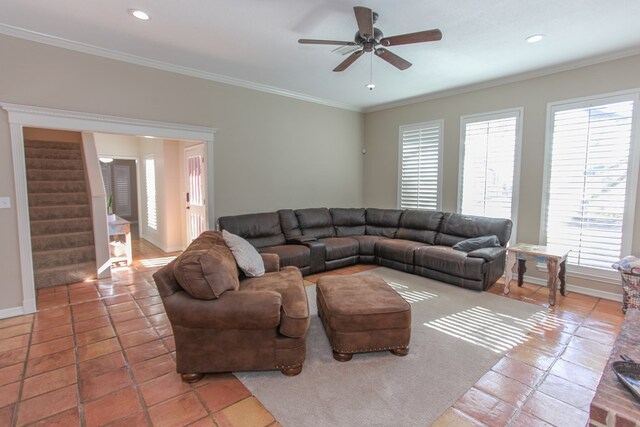 tiled living room featuring crown molding and ceiling fan