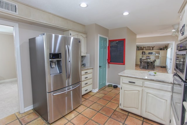 kitchen with light stone counters, ceiling fan, and appliances with stainless steel finishes