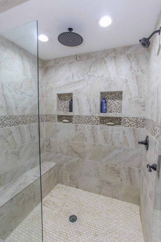 bathroom with tiled shower