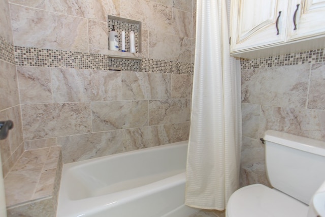 bathroom with shower / bath combination with curtain and toilet