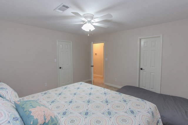 carpeted bedroom with ceiling fan