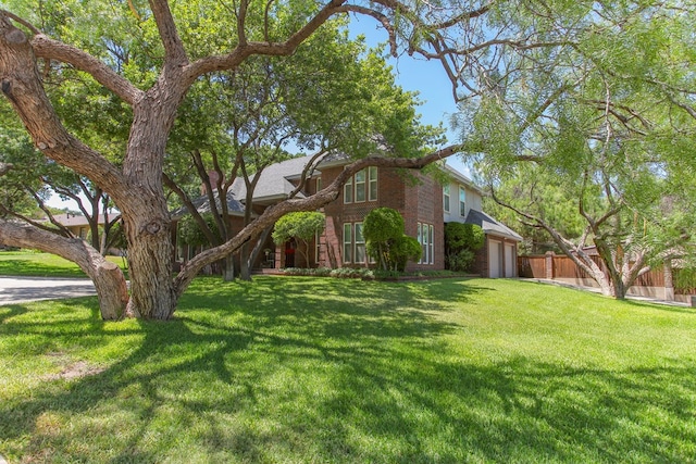 view of front of house with a garage and a front yard