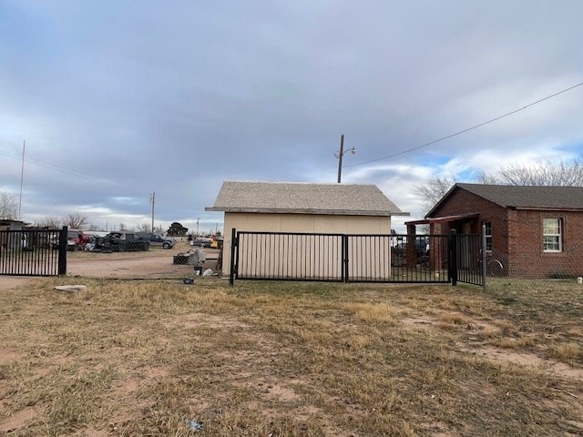 exterior space with an outbuilding and a garage