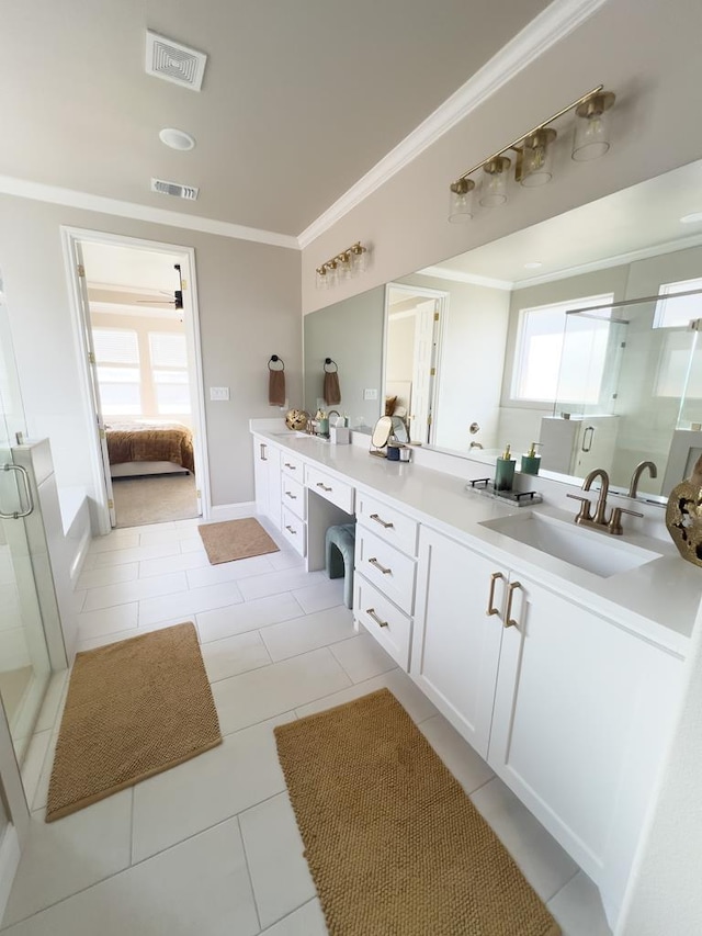 full bathroom featuring a stall shower, visible vents, crown molding, and vanity