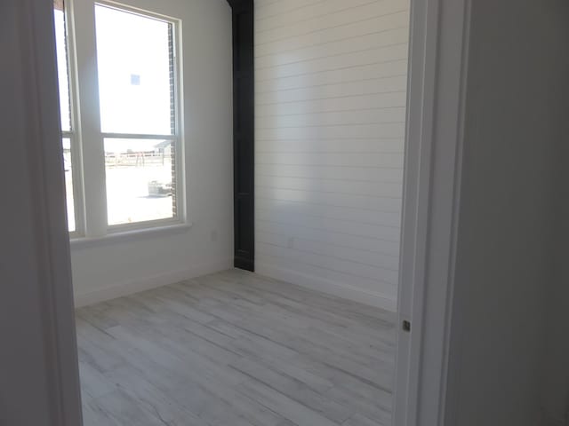 spare room featuring light hardwood / wood-style floors