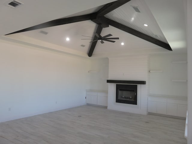 unfurnished living room with ceiling fan, beam ceiling, light hardwood / wood-style floors, and high vaulted ceiling