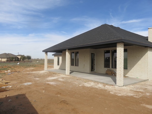 back of house featuring a patio area