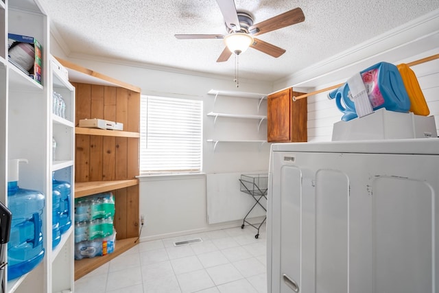 clothes washing area featuring visible vents, ceiling fan, laundry area, washer / clothes dryer, and a textured ceiling