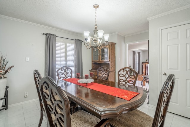 dining area featuring baseboards, ornamental molding, light tile patterned flooring, a notable chandelier, and a textured ceiling