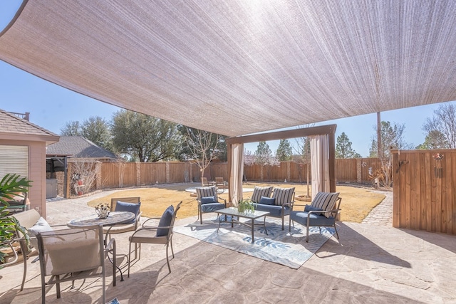 view of patio / terrace featuring outdoor lounge area, outdoor dining space, and a fenced backyard