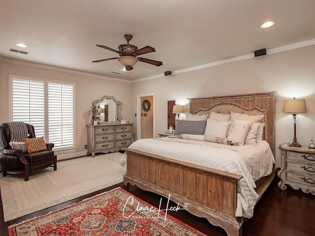 bedroom with wood-type flooring, ornamental molding, and ceiling fan