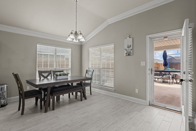 403 Mile High Ln, Midland, TX 79706 - dining area featuring a chandelier, baseboards, light wood-type flooring, ornamental molding, and lofted ceiling
