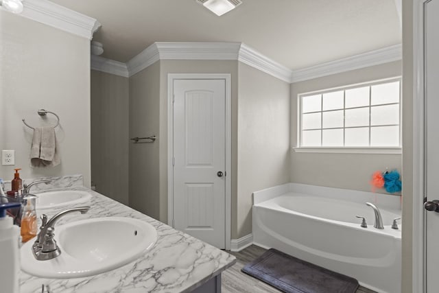 403 Mile High Ln, Midland, TX 79706 - full bath featuring double vanity, a bath, wood finished floors, ornamental molding, and baseboards