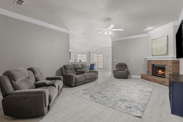 403 Mile High Ln, Midland, TX 79706 - living room featuring a ceiling fan, a fireplace, light wood-style flooring, baseboards, and crown molding