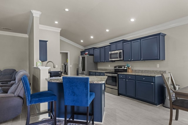 403 Mile High Ln, Midland, TX 79706 - kitchen featuring stainless steel appliances, blue cabinets, a kitchen breakfast bar, light wood-type flooring, and ornamental molding